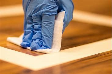 Lead abatement professional applying sealant
